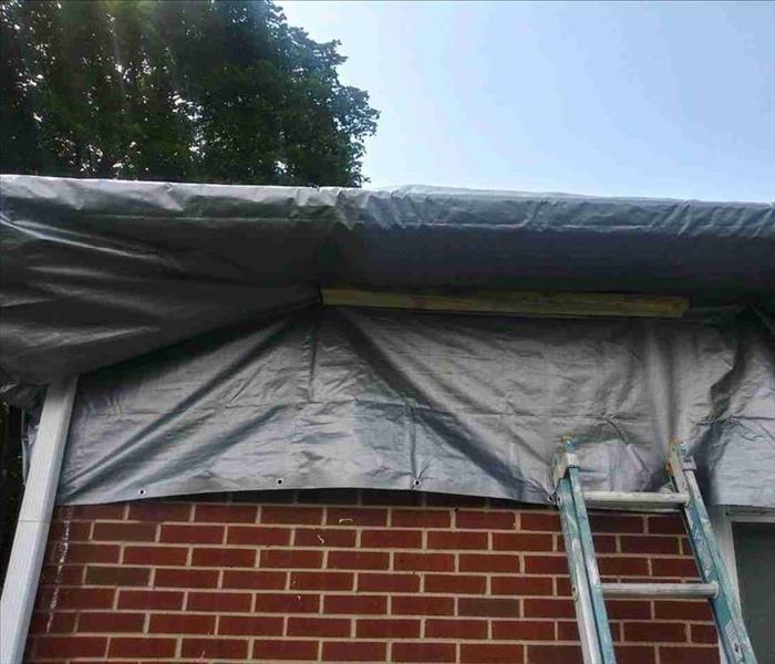 Roof damage needs a tarp to cover open areas